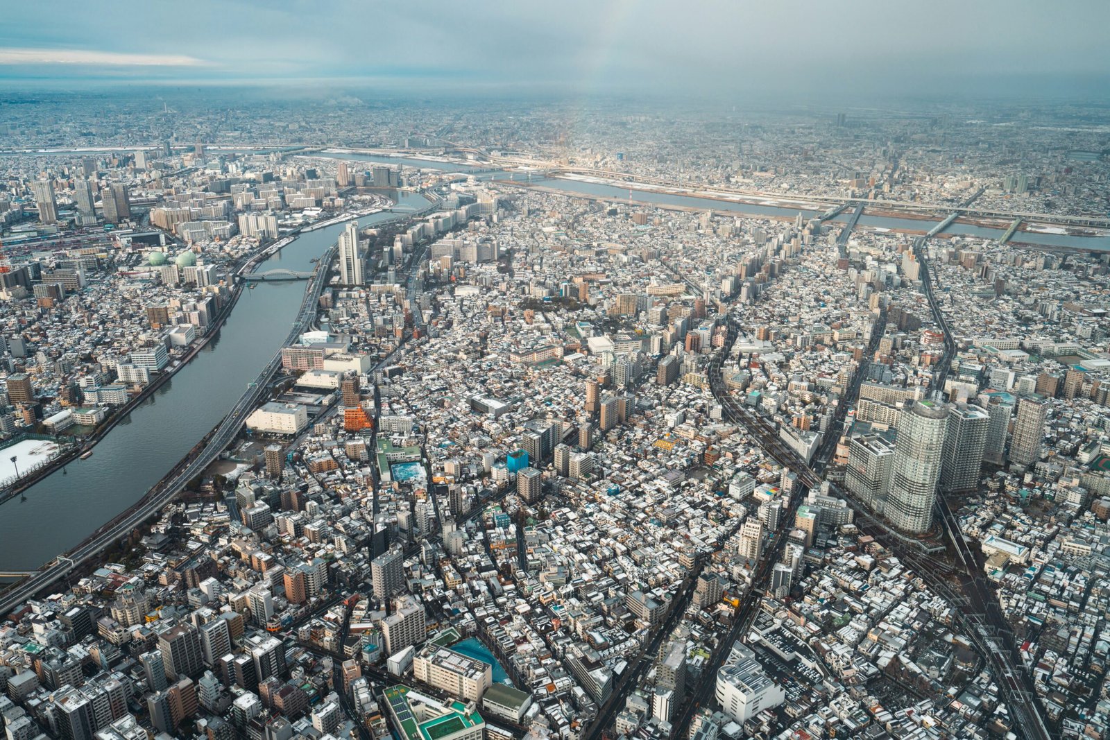 an aerial view of a city with a river running through it